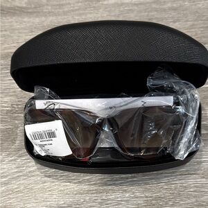 Salvatore Ferragamo Tortoise Sunglasses with SF Logo at Temples.